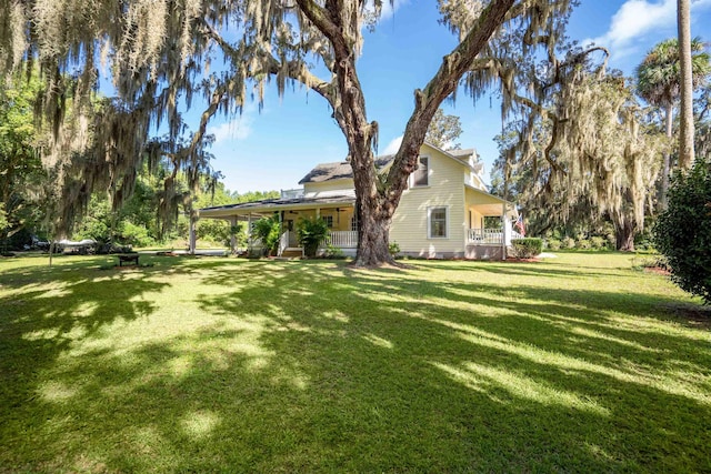 view of yard with covered porch