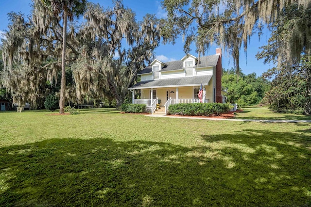 view of front of home featuring a porch and a front lawn