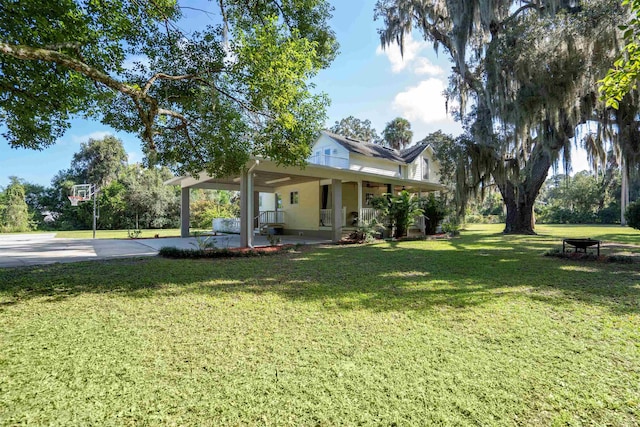 view of yard with covered porch