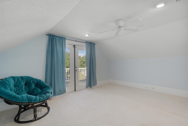 additional living space with carpet flooring, ceiling fan, a textured ceiling, and vaulted ceiling