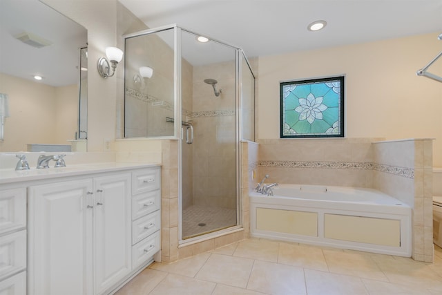 full bathroom with tile patterned floors, vanity, toilet, and independent shower and bath