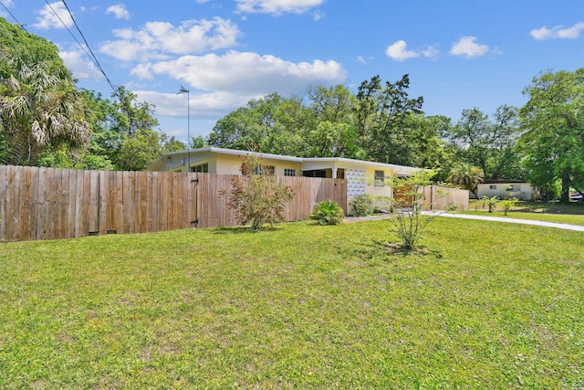 1300 Francis St, Saint Augustine, FL 32084 - view of front of house with concrete driveway, a front lawn, and fence