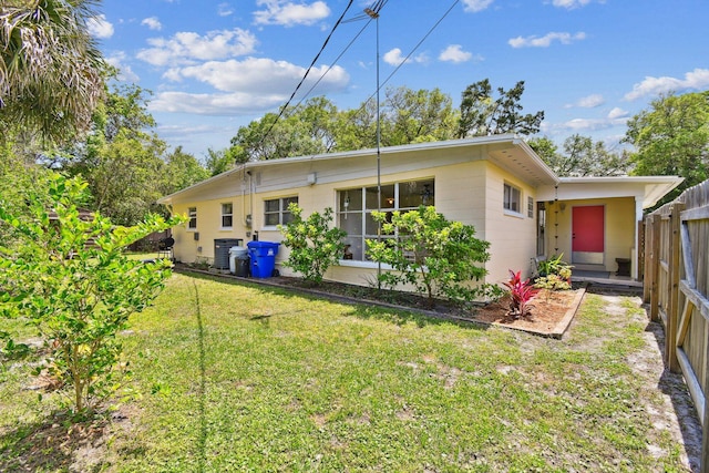 1300 Francis St, Saint Augustine, FL 32084 - exterior space with cooling unit, a yard, fence, and concrete block siding