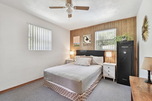 1300 Francis St, Saint Augustine, FL 32084 - bedroom with wooden walls, carpet floors, a ceiling fan, and baseboards