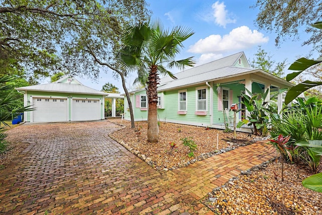 146 Istoria Dr, Saint Augustine, FL 32095 - view of front facade featuring a porch, an attached garage, and driveway