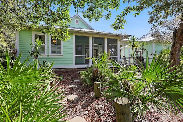 146 Istoria Dr, Saint Augustine, FL 32095 - view of front facade with metal roof and a sunroom