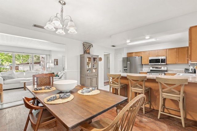 503 D St, Saint Augustine, FL 32080 - dining space with wood finished floors, a chandelier, and recessed lighting