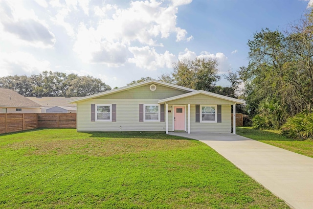 ranch-style home with a front lawn