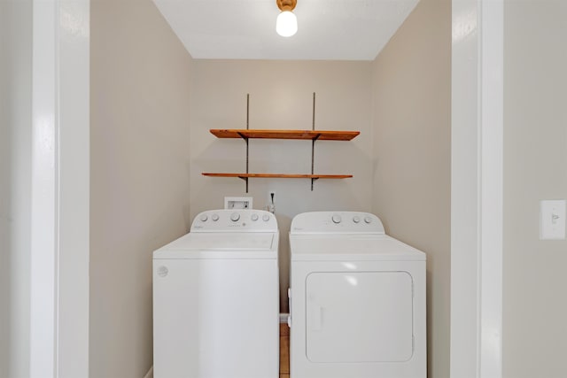 washroom with independent washer and dryer