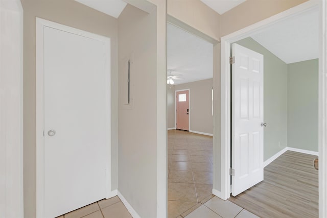 corridor with light tile patterned floors