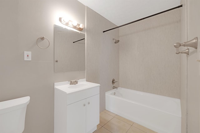 full bathroom with vanity, tiled shower / bath, tile patterned floors, and toilet