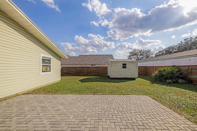 view of patio with a storage unit