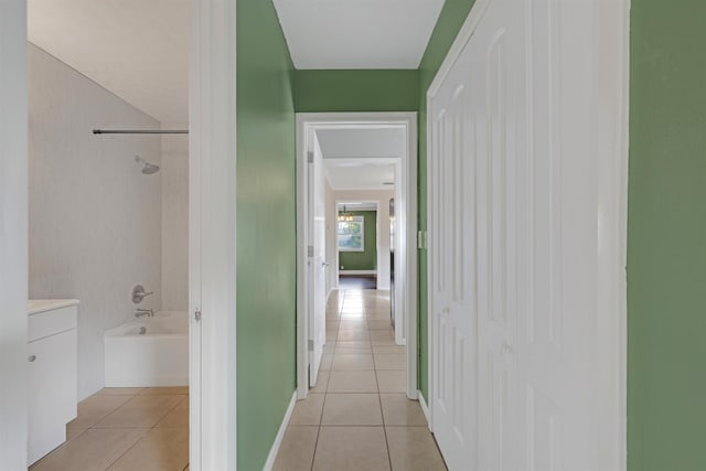 corridor featuring light tile patterned floors