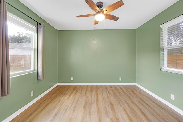 spare room with ceiling fan and light hardwood / wood-style floors