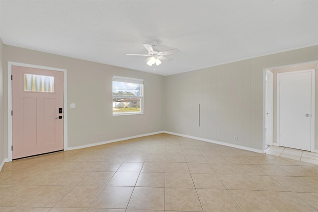 entrance foyer featuring light tile patterned floors and ceiling fan