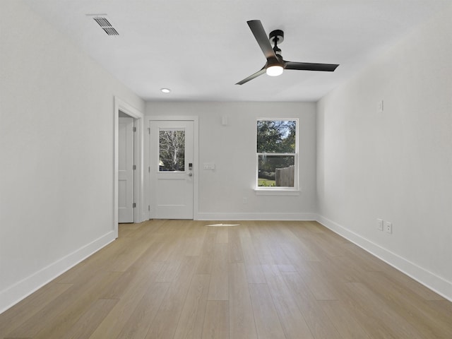 unfurnished room featuring light hardwood / wood-style floors and ceiling fan