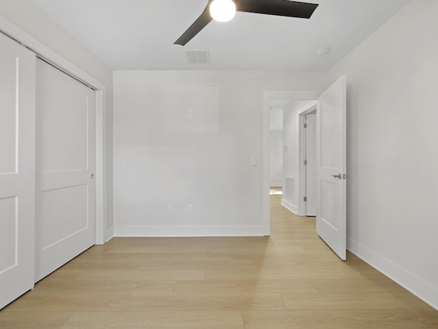 unfurnished bedroom featuring ceiling fan and light hardwood / wood-style flooring