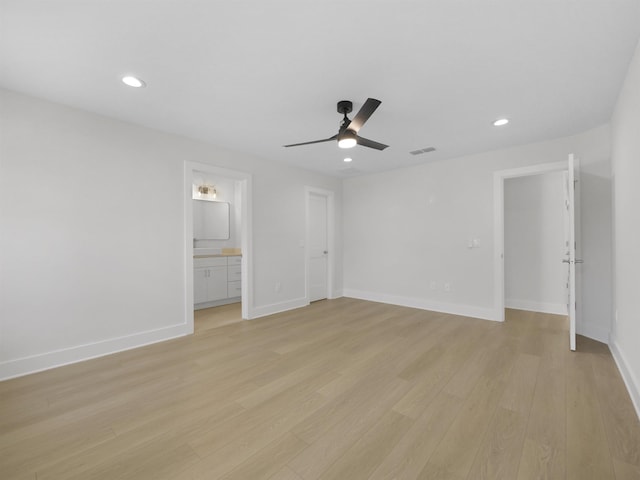 unfurnished bedroom featuring ensuite bathroom, ceiling fan, and light hardwood / wood-style flooring