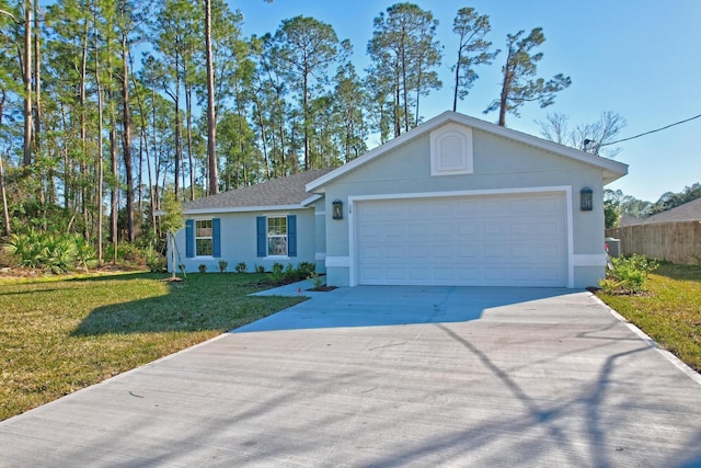 ranch-style house featuring a garage and a front yard