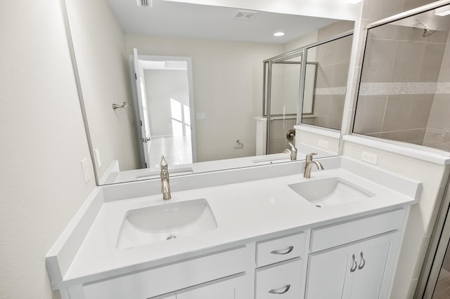 bathroom with vanity and an enclosed shower