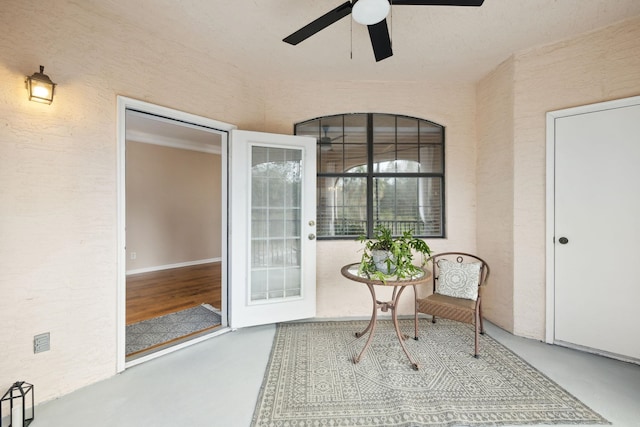 entrance to property featuring ceiling fan