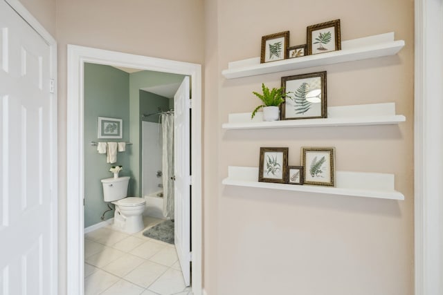 bathroom featuring shower / bath combo, toilet, and tile patterned floors