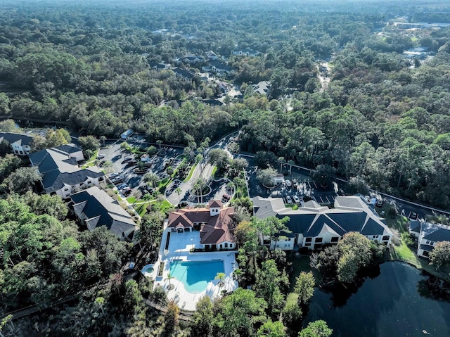 birds eye view of property featuring a residential view and a view of trees