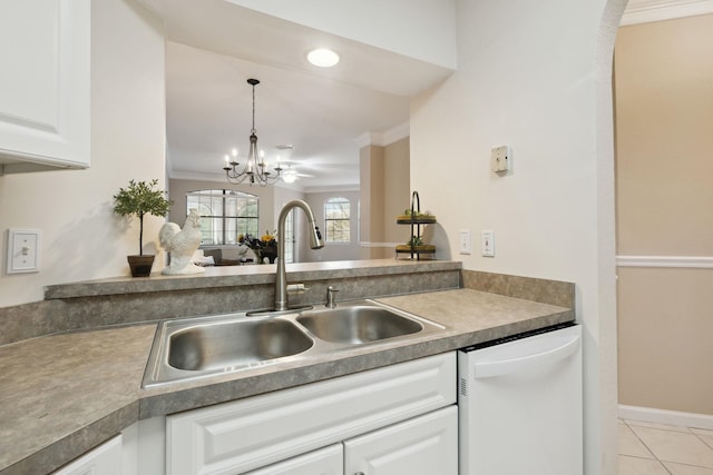 kitchen featuring dishwasher, a sink, white cabinetry, and crown molding