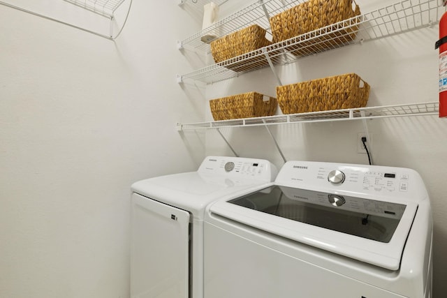 laundry room with laundry area and washer and clothes dryer