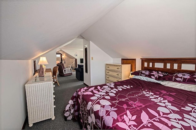 bedroom featuring carpet floors and vaulted ceiling