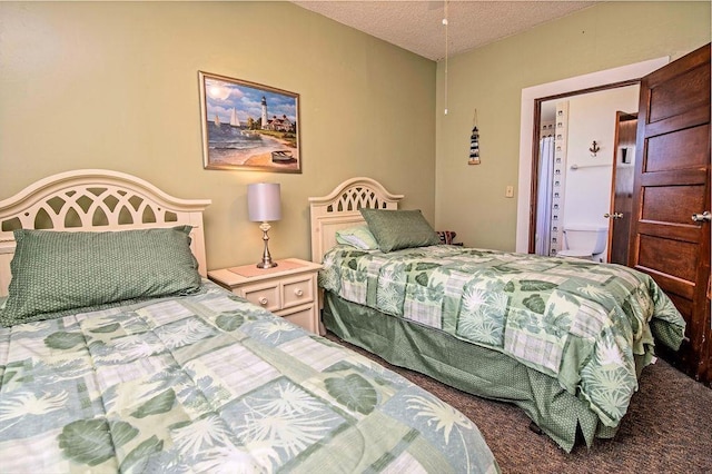 bedroom featuring carpet and a textured ceiling