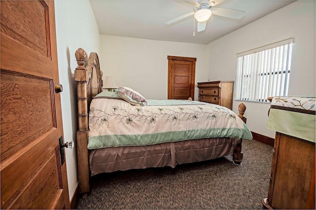 bedroom featuring dark colored carpet and ceiling fan