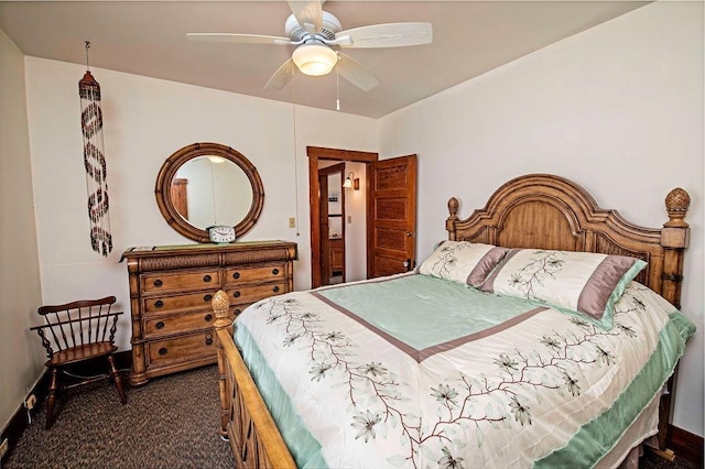 bedroom with ceiling fan and dark carpet