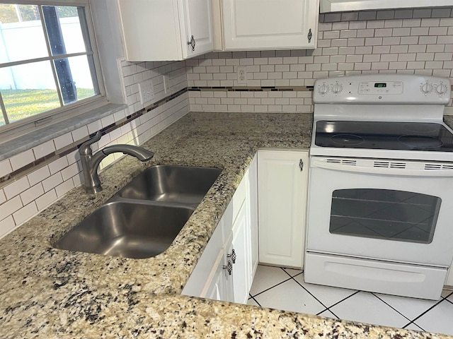 kitchen with backsplash, white cabinets, sink, white electric stove, and light tile patterned floors