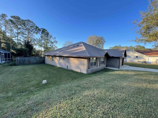 view of property exterior featuring a lawn