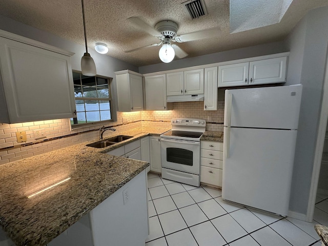 kitchen with decorative backsplash, sink, white cabinets, and white appliances