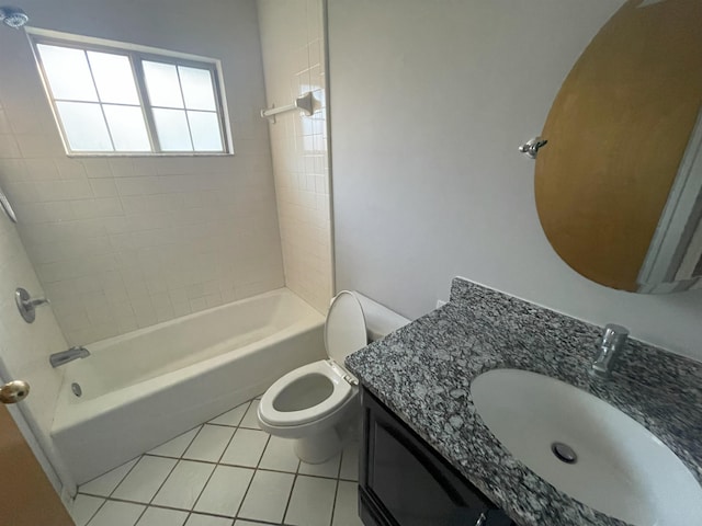 full bathroom with toilet, vanity, tile patterned floors, and tiled shower / bath