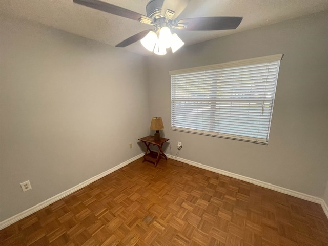 unfurnished room with parquet flooring and ceiling fan