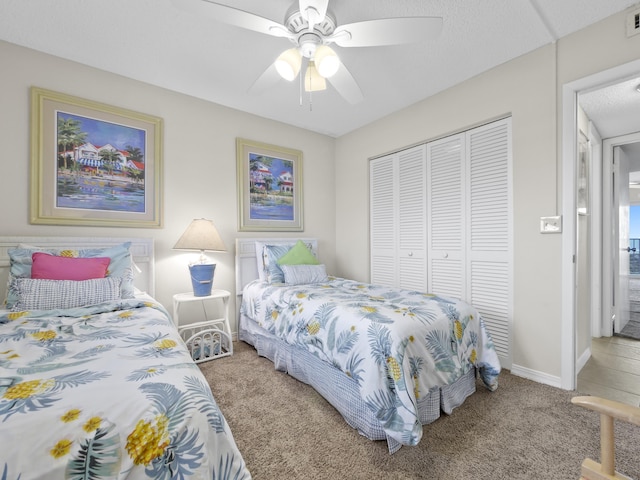 bedroom with visible vents, ceiling fan, baseboards, carpet flooring, and a closet