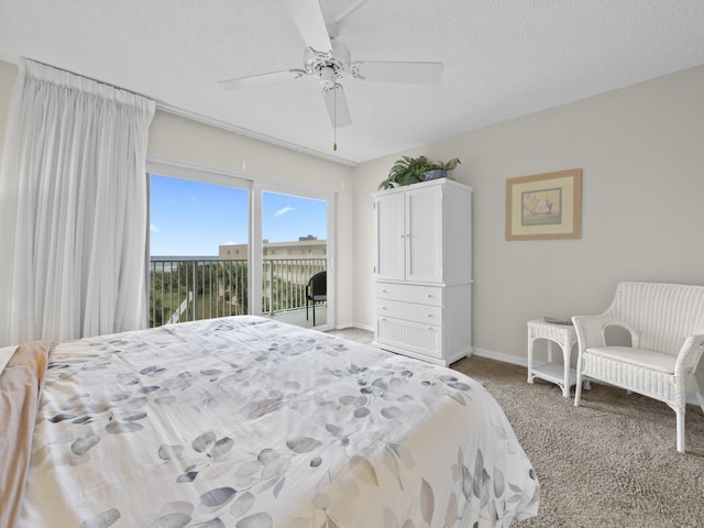 carpeted bedroom featuring ceiling fan, baseboards, a textured ceiling, and access to exterior