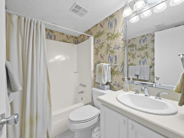 full bath featuring visible vents, wallpapered walls, vanity, shower / tub combo, and a textured ceiling