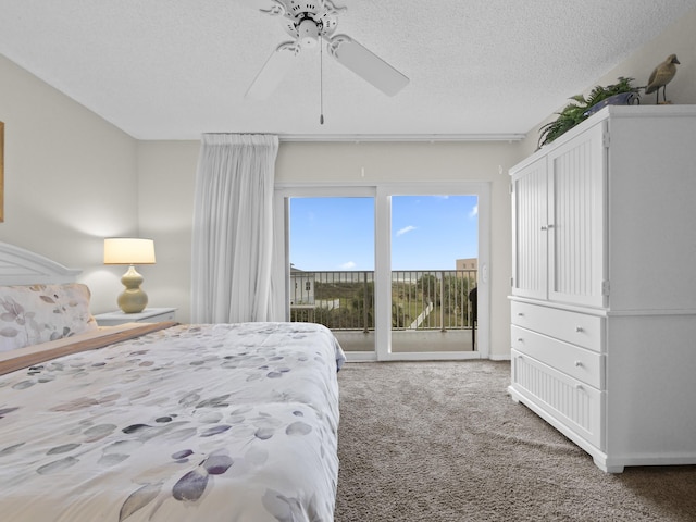 bedroom featuring ceiling fan, access to outside, carpet flooring, and a textured ceiling