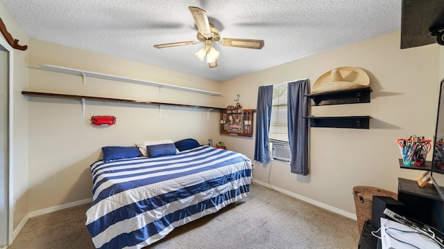 carpeted bedroom with ceiling fan and a textured ceiling