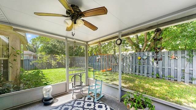 sunroom featuring a wealth of natural light and ceiling fan