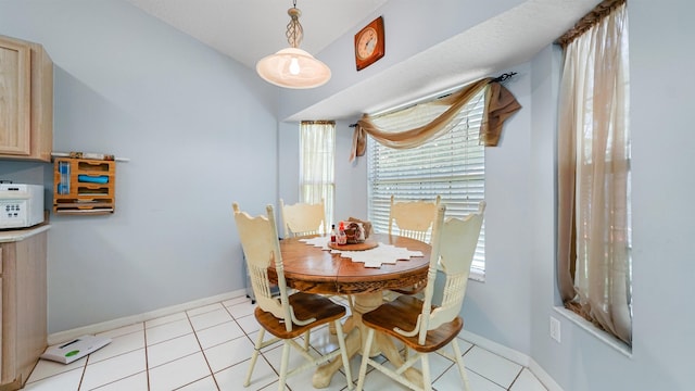 dining area featuring light tile patterned floors