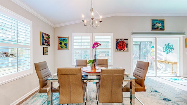 dining area with lofted ceiling, hardwood / wood-style flooring, ornamental molding, and a chandelier