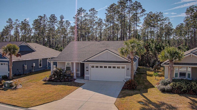 view of front of home featuring a garage and a front yard