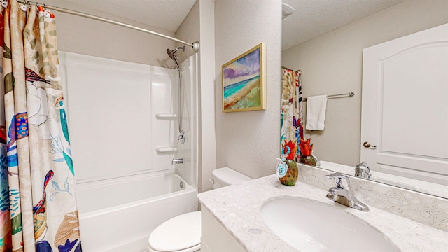 full bathroom featuring shower / bath combo, vanity, a textured ceiling, and toilet