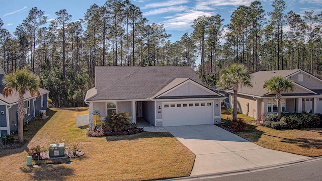 view of front of home featuring a garage and a front yard