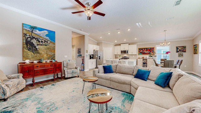 living room featuring hardwood / wood-style flooring, ornamental molding, and ceiling fan with notable chandelier